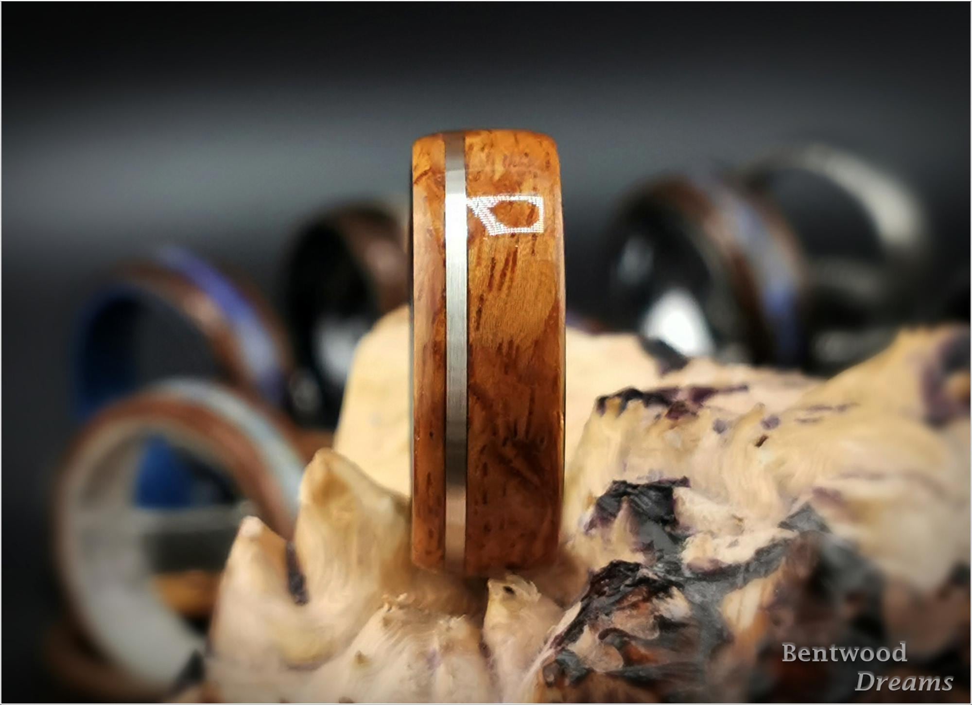 Bentwood Ring: Quilted Afzelia, offset inlaid Sterling Silver, Polished Black Ceramic core, wood ring