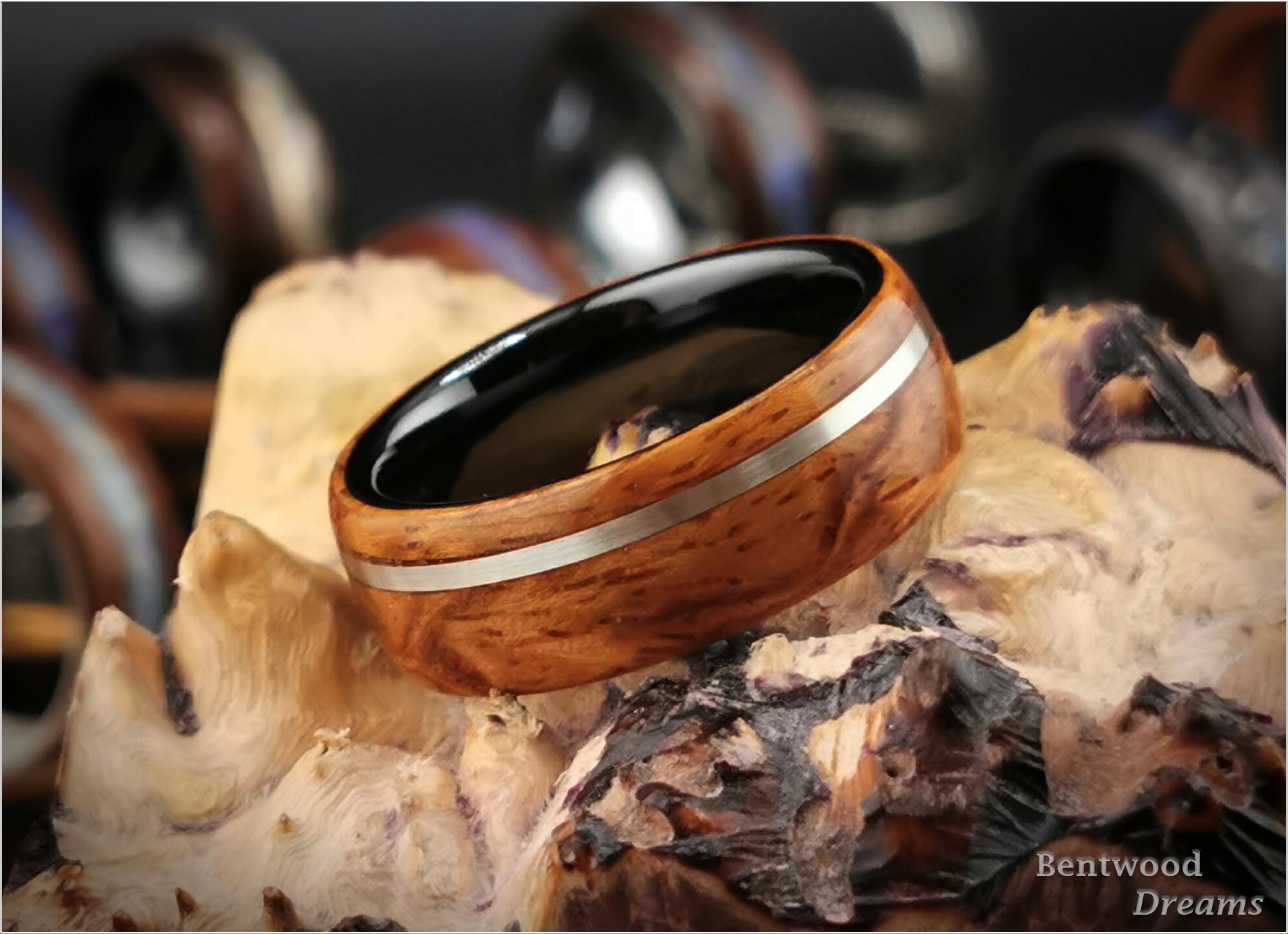Bentwood Ring: Quilted Afzelia, offset inlaid Sterling Silver, Polished Black Ceramic core, wood ring