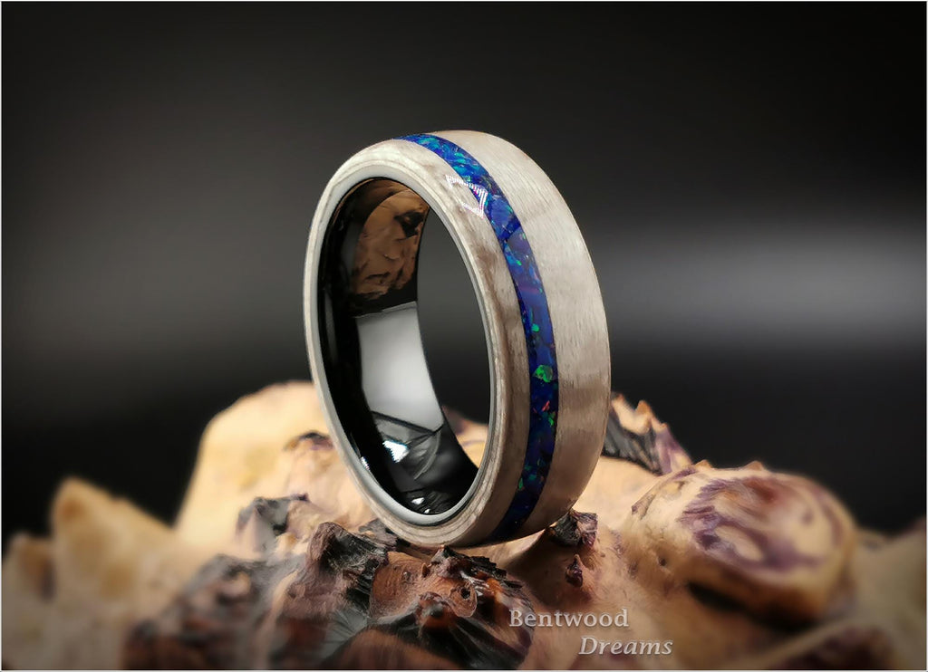 Bentwood Ring: Silver Birdseye Maple, offset inlaid Opal, Polished Black Ceramic core, wood ring