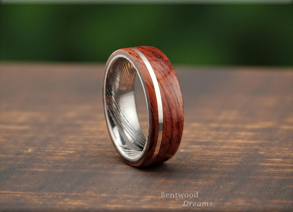 Bentwood Ring: Waterfall Bubinga, offset inlaid Sterling Silver wire, Damascus Steel core, wood ring