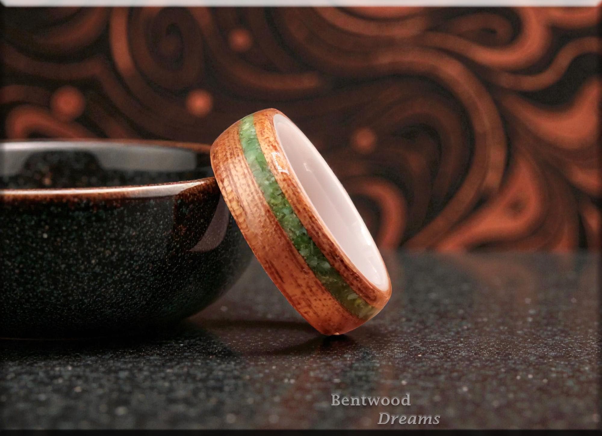 Bentwood Ring: Okoume, offset inlaid Nevada Apple Variscite, polished White Ceramic core, wood ring