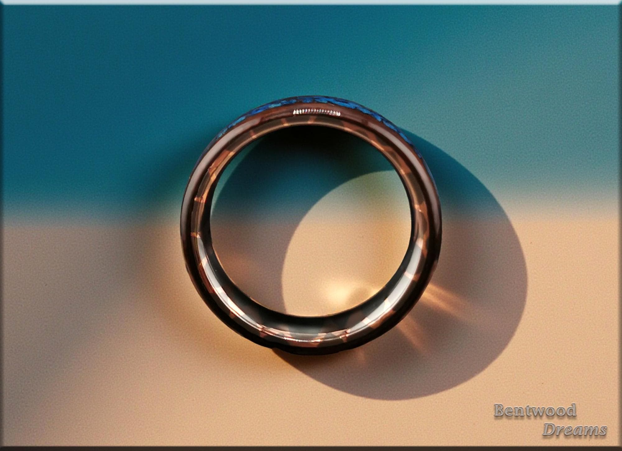 Bentwood Ring: Smoked Etimoe, inlaid Sterling Silver and Shattuckite, Superconductor core