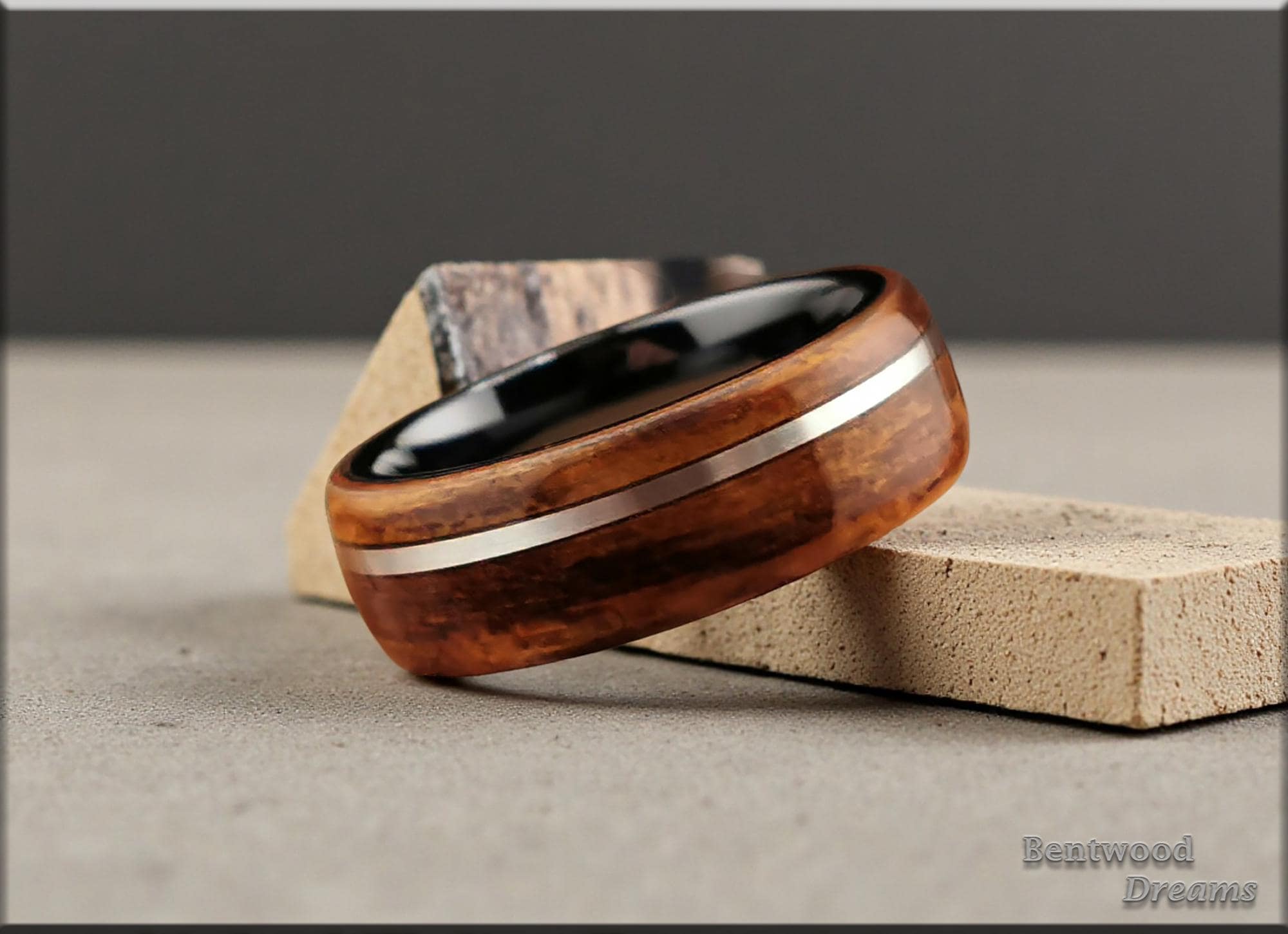 Bentwood Ring: Ako, inlaid offset Sterling Silver wire, Polished Black Ceramic core, wood ring