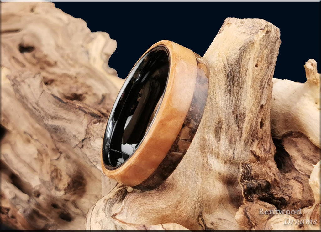 Bentwood Ring: Figured Maple, live edge inlaid Velociraptor Bone, polished Black Ceramic core